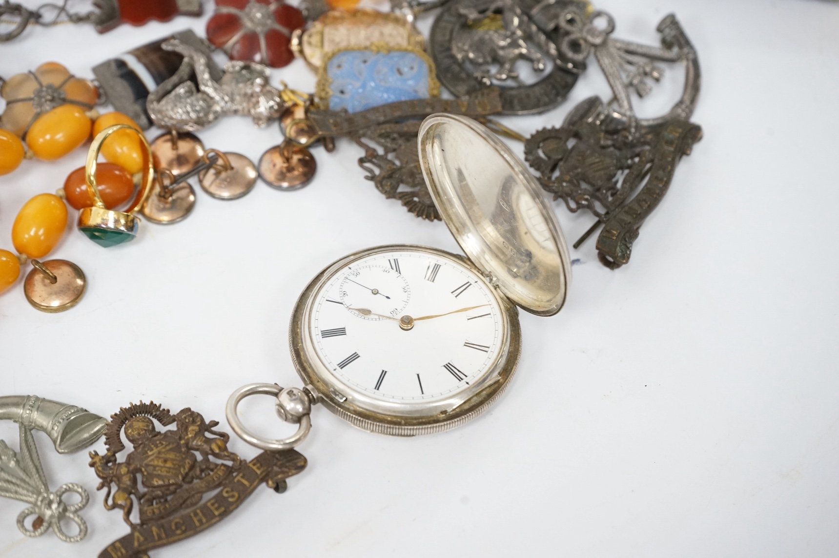 Assorted jewellery including an amber bead necklace, 46cm, gross 29 grams, a white metal and Scottish hardstone set necklace, cufflinks, dress studs, ring, a silver hunter pocket watch, engraved yellow metal oval locket,